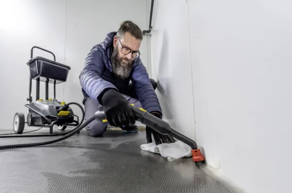 Steam cleaner in use on a floor